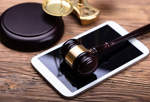 Gavel and tablet in a court of law