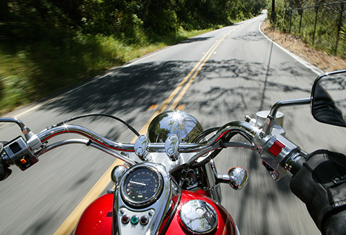 front of motorcycle riding on road